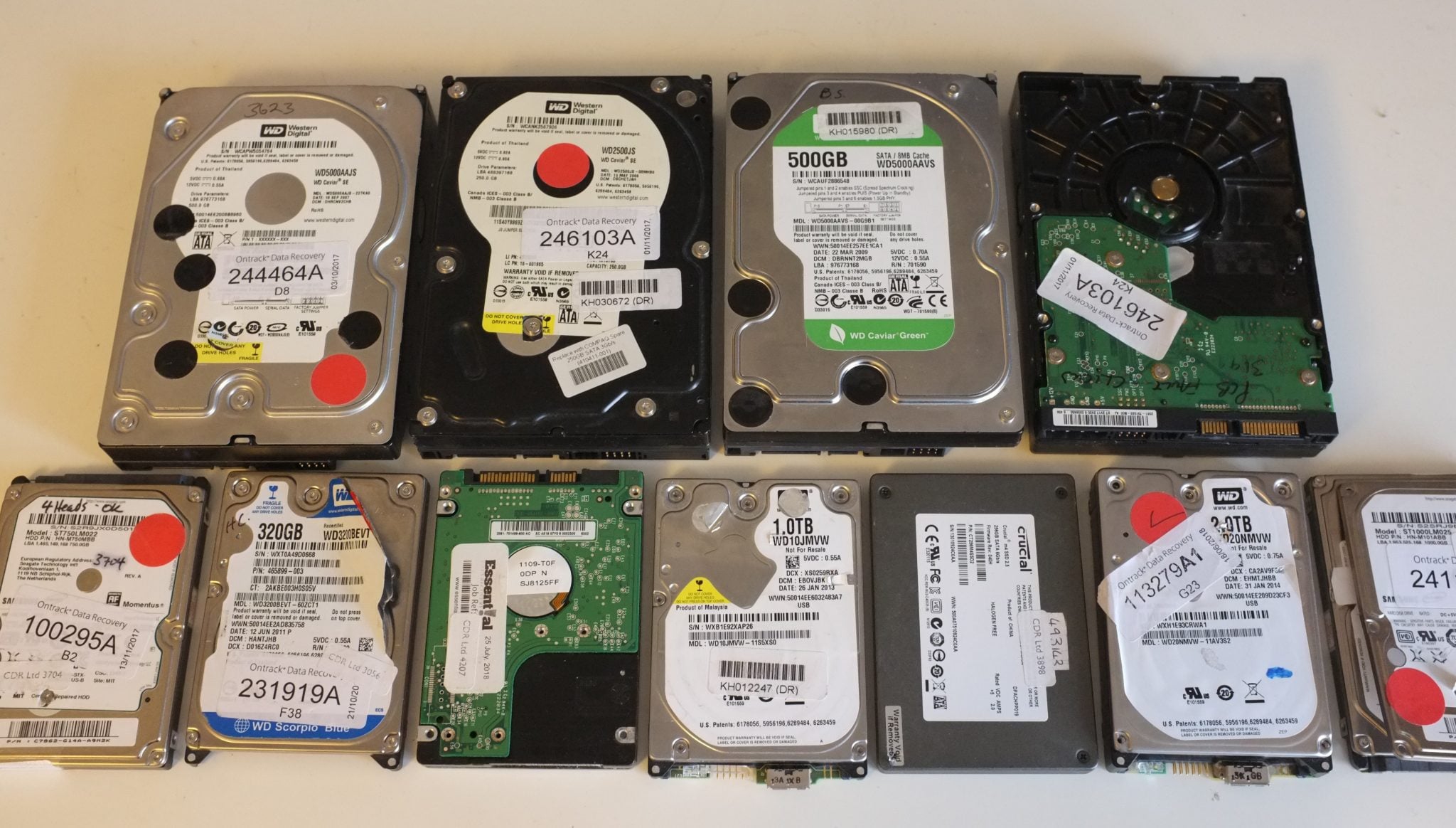 Multiple HDDs previously opened by data recovery companies